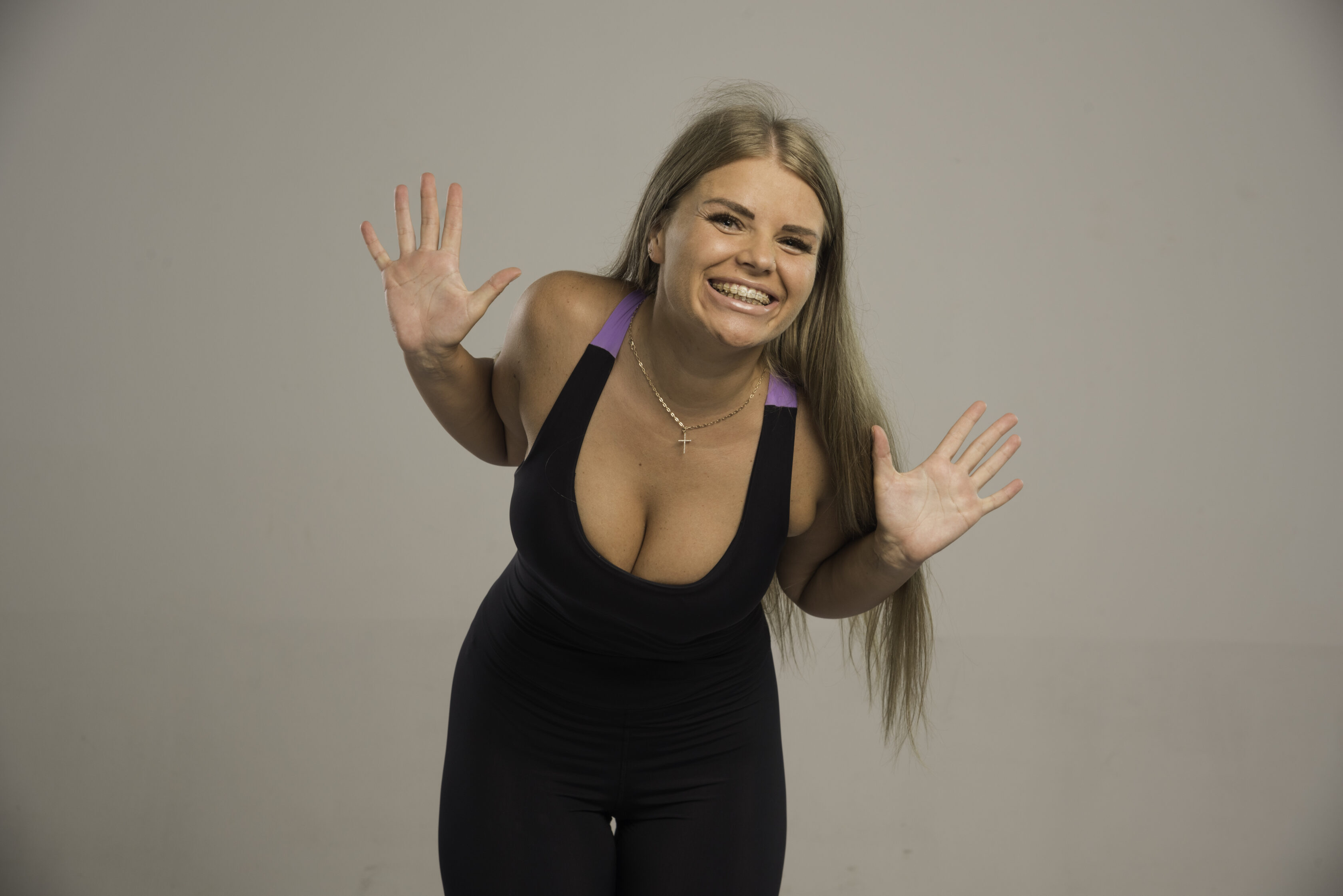 Female model in sport bra looks positive. High quality photo